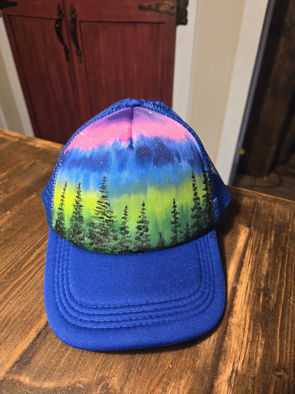 Hand-Painted Blue Unisex OS Trucker Hat with Colorful Forest Design